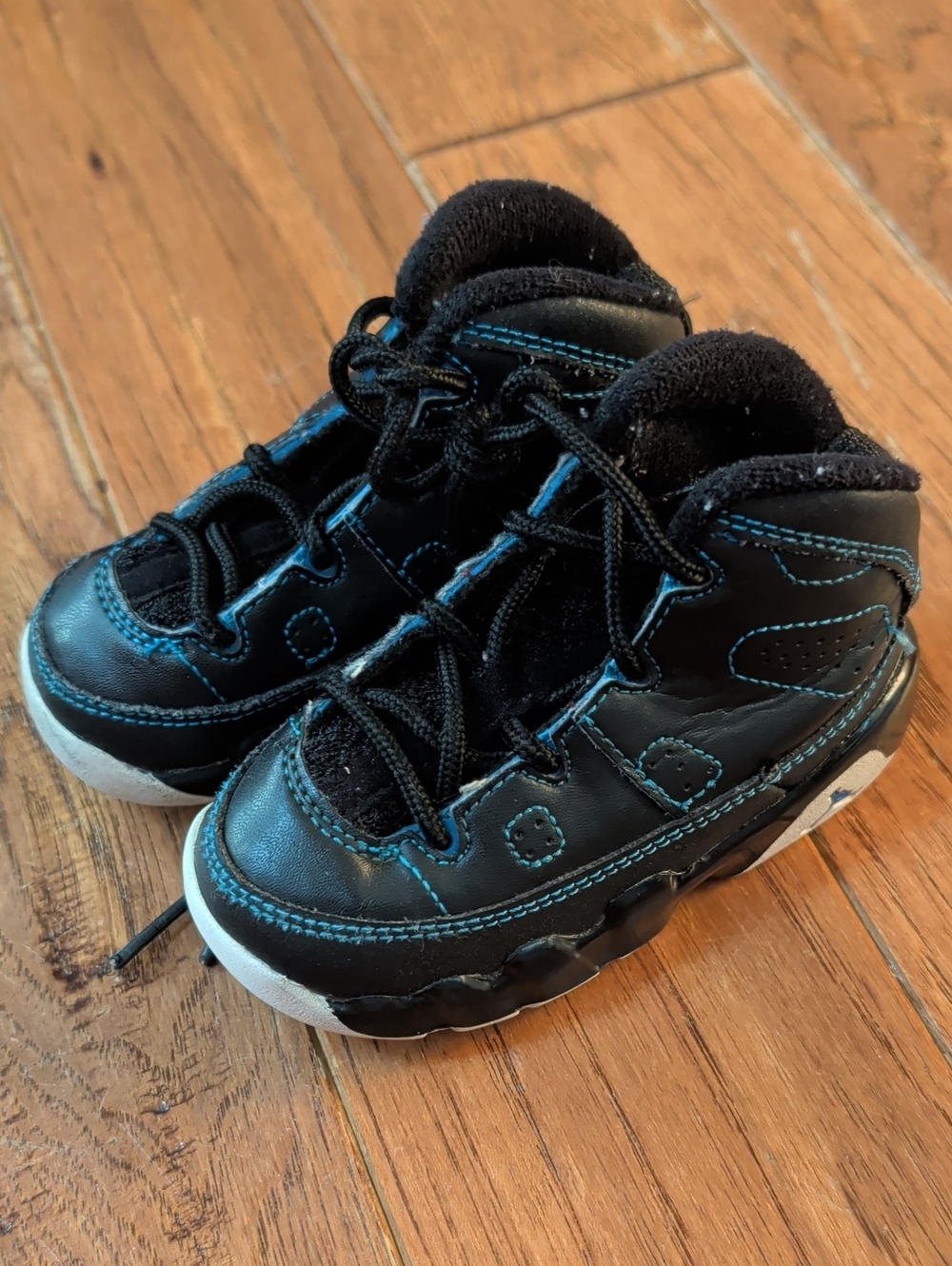 Nike Jordan XI 9 Retro Kids Black Sneakers with Blue Stitching